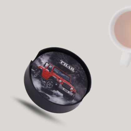 Sophisticated Round Black Tea Coaster with Subtle Red Logo